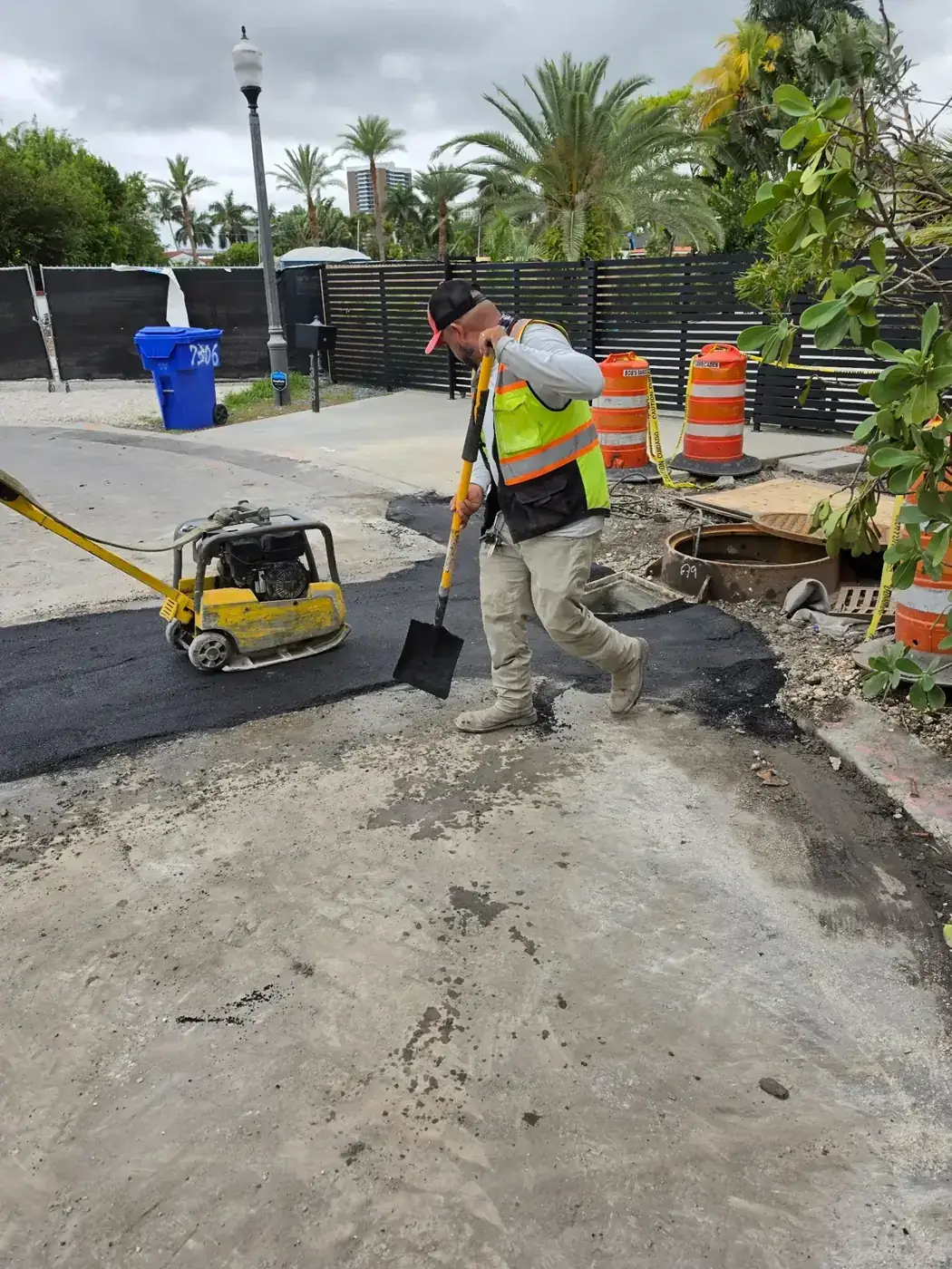 Construction crew performing asphalt restoration on a South Florida worksite
