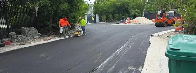 Belle Meade Island Roundabout: Paver and crew placing the mat