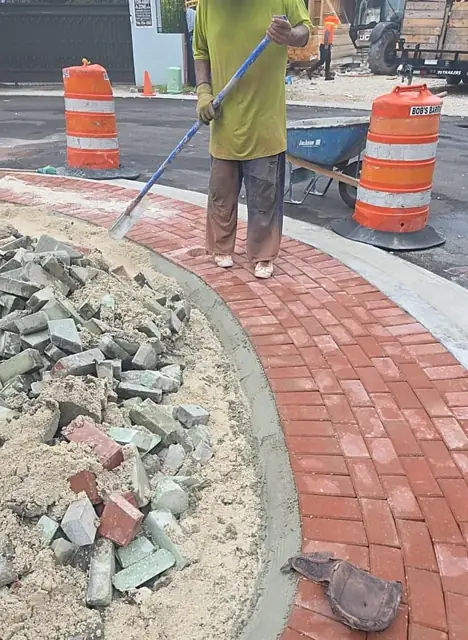 Belle Meade Island Roundabout: Sweeping sand into the paver joints