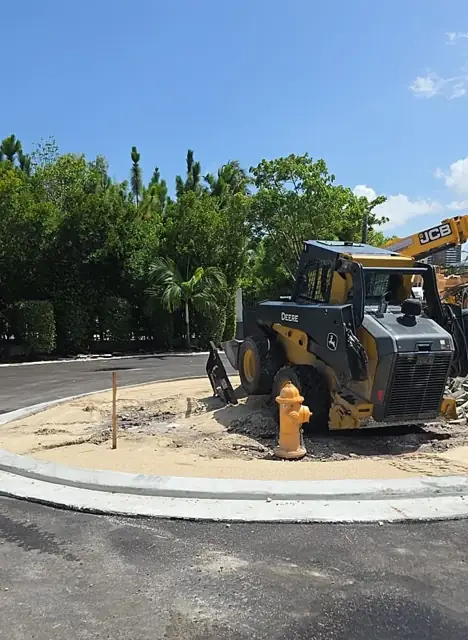 Belle Meade Island Roundabout: Loader staged at the paver apron