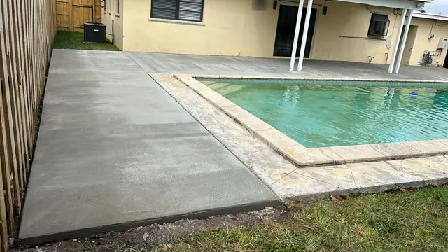 Concrete Pool Deck & Patio, Cutler Bay: After: continuous concrete deck around the pool
