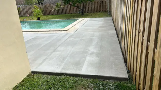 Concrete Pool Deck & Patio, Cutler Bay: After: side-yard deck from the house to the fence line