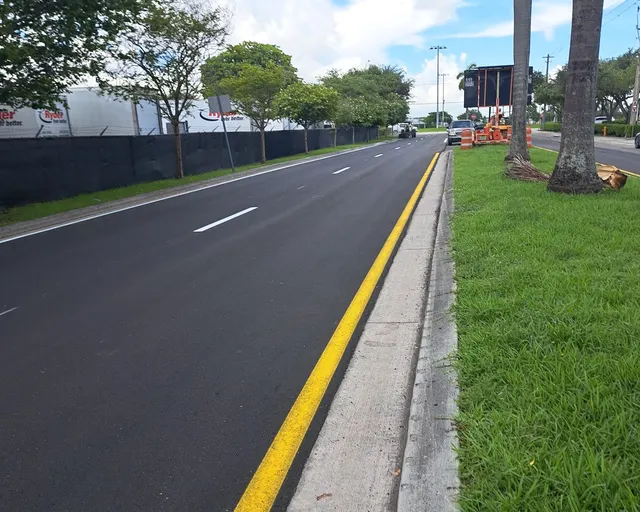 NW 30th Terrace Milling & Resurfacing: New asphalt surface with yellow median edge line and white lane skips