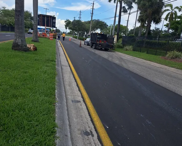 NW 30th Terrace Milling & Resurfacing: New asphalt beside the milled surface of the opposite lanes