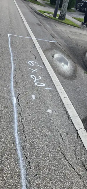 Asphalt Patching, Hollywood Beach: Before: cracked pavement along the bike lane, marked 6 x 20 ft