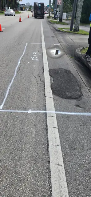 Asphalt Patching, Hollywood Beach: Before: old patch and ponding beside the inlet