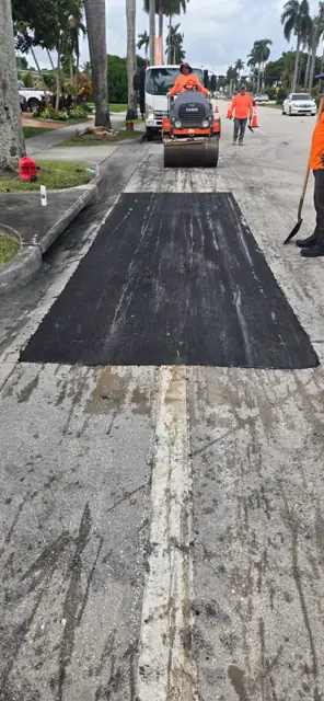 Asphalt Patching, Hollywood Beach: Compacting the new asphalt with a tandem roller
