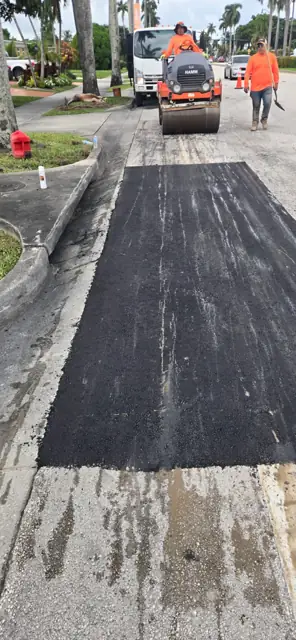 Asphalt Patching, Hollywood Beach: Rolling a second patch under lane closure