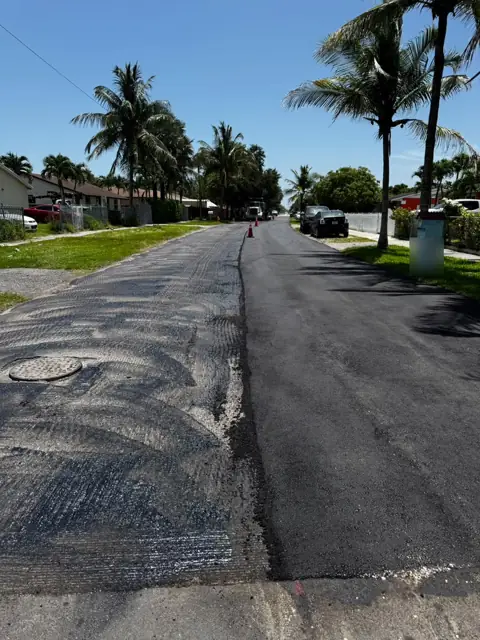 Milled lane on the left, new asphalt on the right