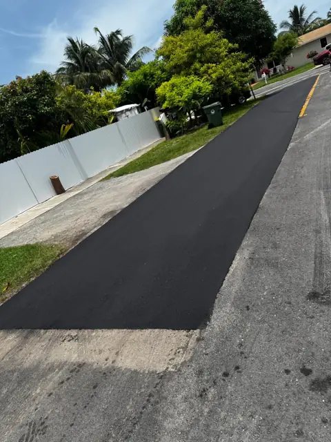 Milling & Resurfacing, City of Homestead: New asphalt along a fenced residential block
