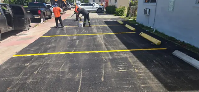 Parking Lot Repaving, Miami Beach: Striping the stalls on the new asphalt