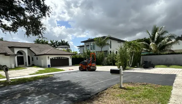 Residential Street Paving, Miami Lakes: After: new surface tied into the paver driveways