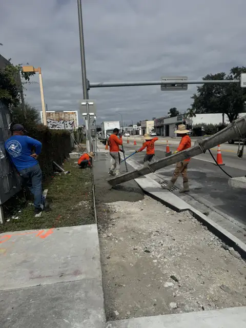 Old sidewalk removed, base prepared and the first concrete going in