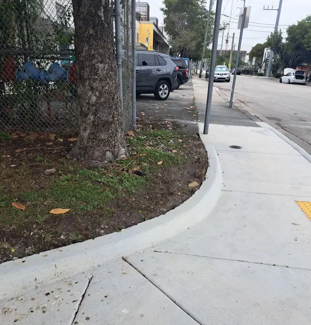 City of Miami Sidewalk Improvements: After: tree well, walk and ramp at the corner
