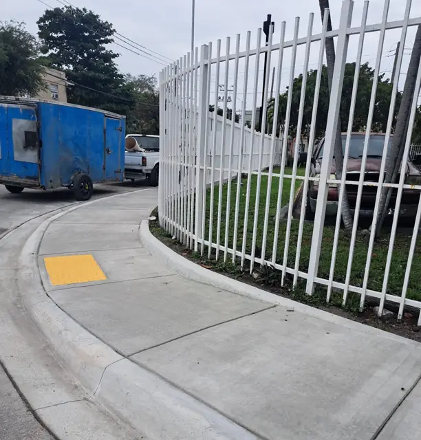 City of Miami Sidewalk Improvements: After: curved walk and curb ramp at the intersection