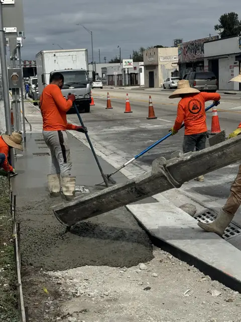 City of Miami Sidewalk Improvements: Placing concrete from the truck chute