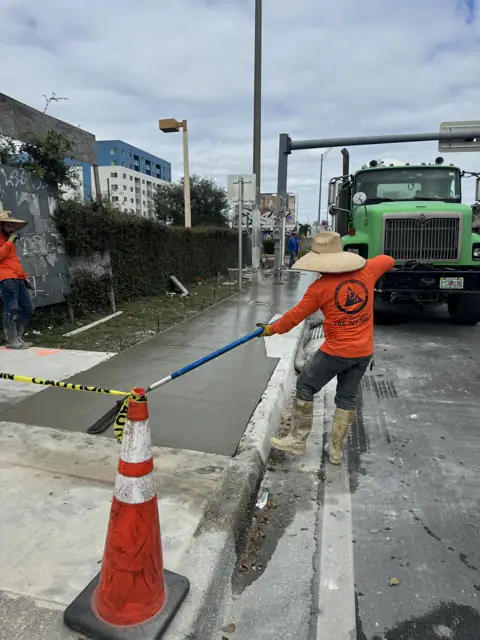 City of Miami Sidewalk Improvements: Finishing the pour beside the curb inlet