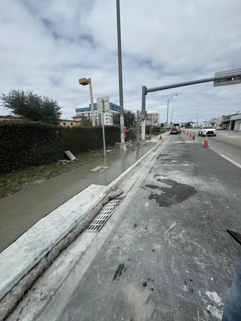 City of Miami Sidewalk Improvements: Protected pour beside the trench drain