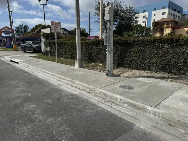 City of Miami Sidewalk Improvements: After: finished walk and curb at the corner