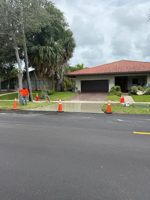 NE 103rd Street — FDOT: Concrete driveway apron restored at the new pavement edge