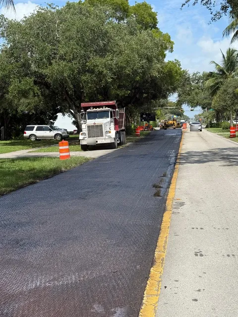 NE 103rd Street — FDOT: Tack coat applied to the milled lane ahead of the paver