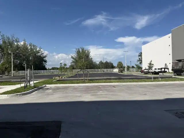 Northside Village: Fine grading the parking field