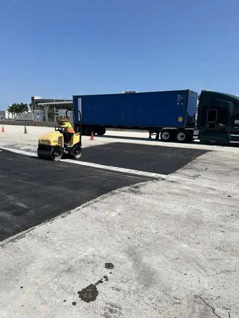 Asphalt Patching, PortMiami: Rolling the new asphalt beside container traffic