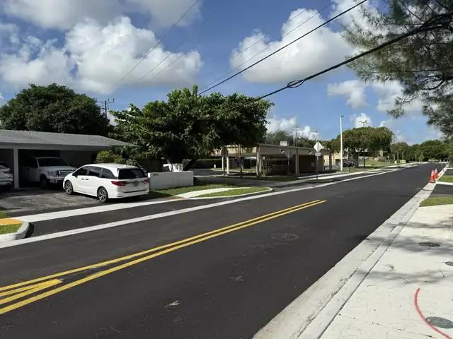 SW 148th Street Roadway Improvements: Asphalt paving over the restored base