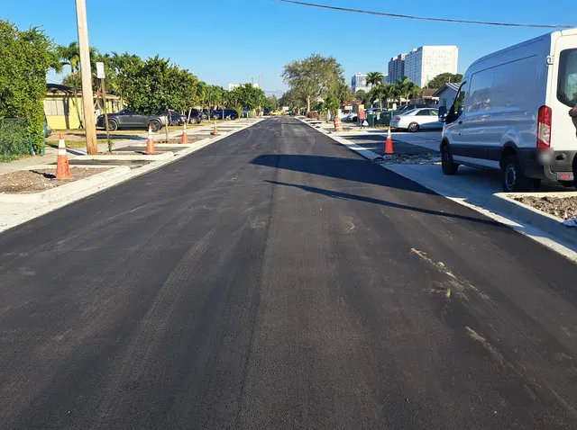 Sweetwater Neighborhood Roadway Improvements: Fresh asphalt surface course with new curb and driveway aprons, December 2024