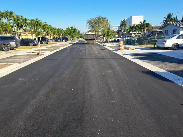 Sweetwater Neighborhood Roadway Improvements: Paving operation in progress along the new curb line
