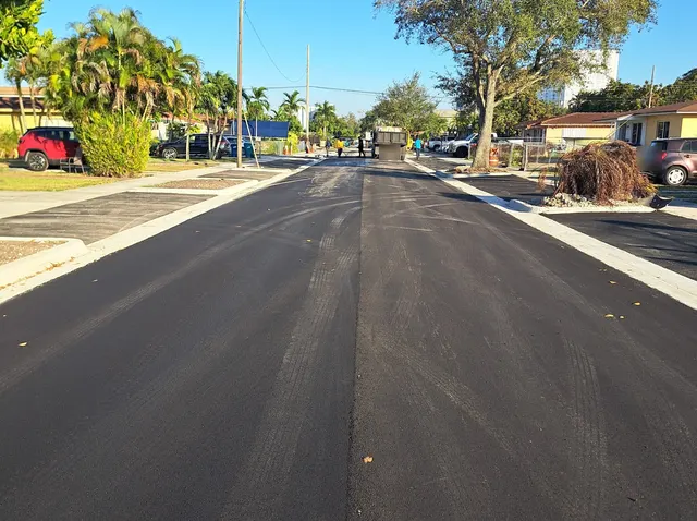 Sweetwater Neighborhood Roadway Improvements: Crew finishing the asphalt surface on SW 5th Terrace