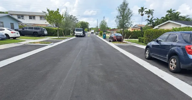Sweetwater Neighborhood Roadway Improvements: New edge line, concrete curb and asphalt driveway apron