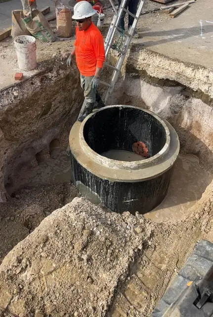 West Little River Sewer & Resurfacing: Manhole base set in the excavation