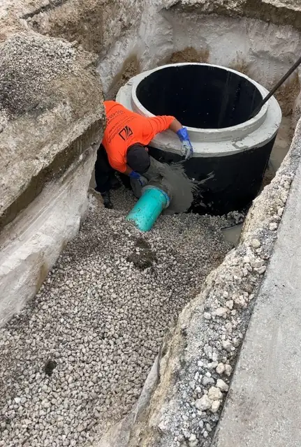 West Little River Sewer & Resurfacing: Grouting the pipe penetration at the manhole