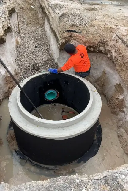 West Little River Sewer & Resurfacing: Manhole with pipe stub ready for the next run