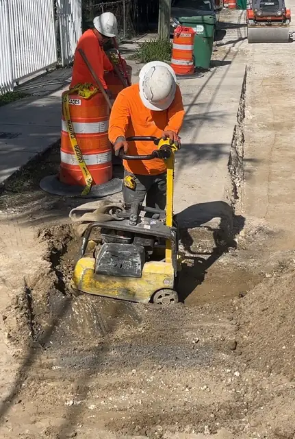 West Little River Sewer & Resurfacing: Plate compaction of trench backfill in lifts