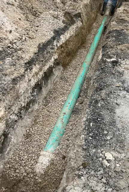 West Little River Sewer & Resurfacing: PVC sewer main laid on bedding